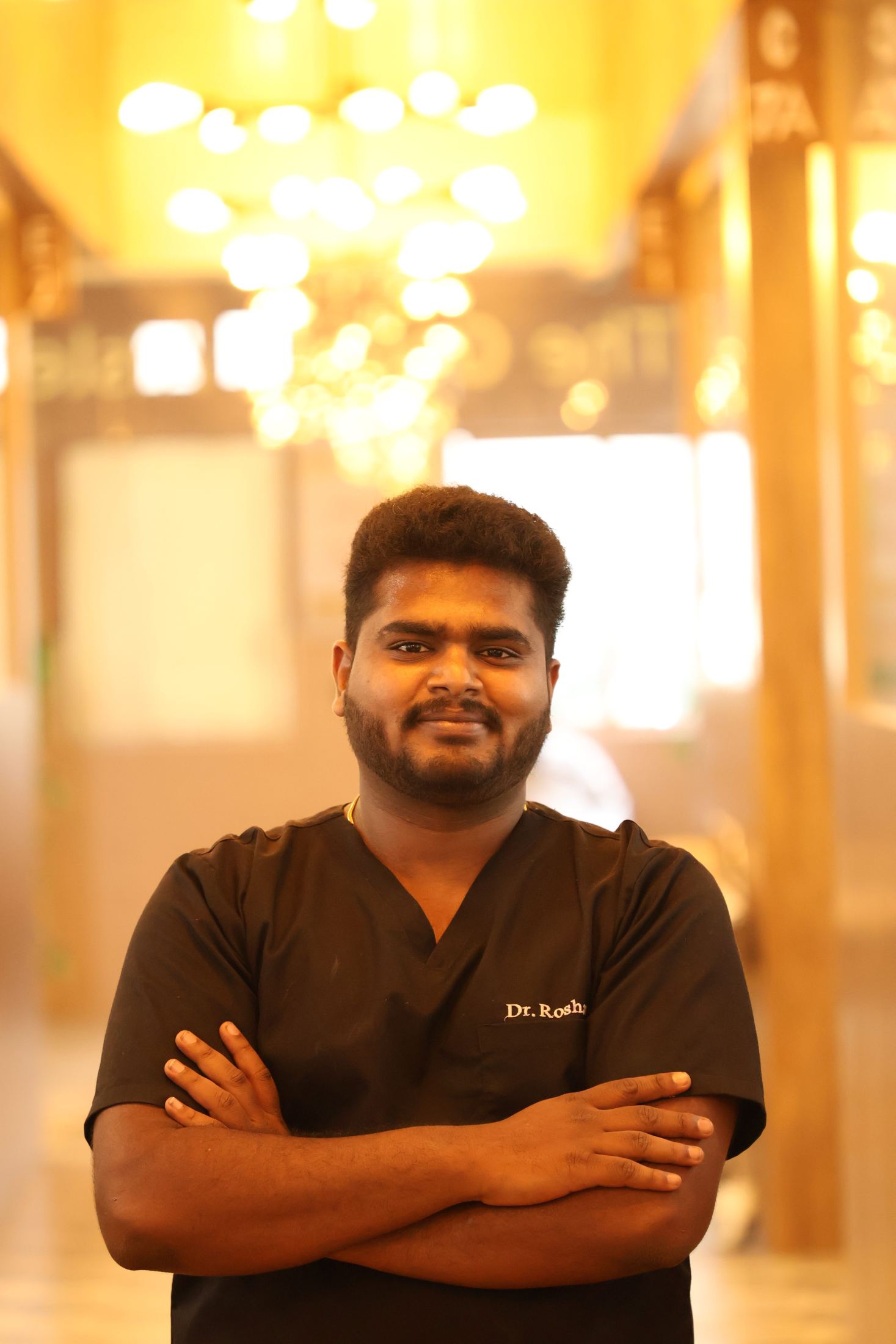 Dr. Roshan standing in dental clinic